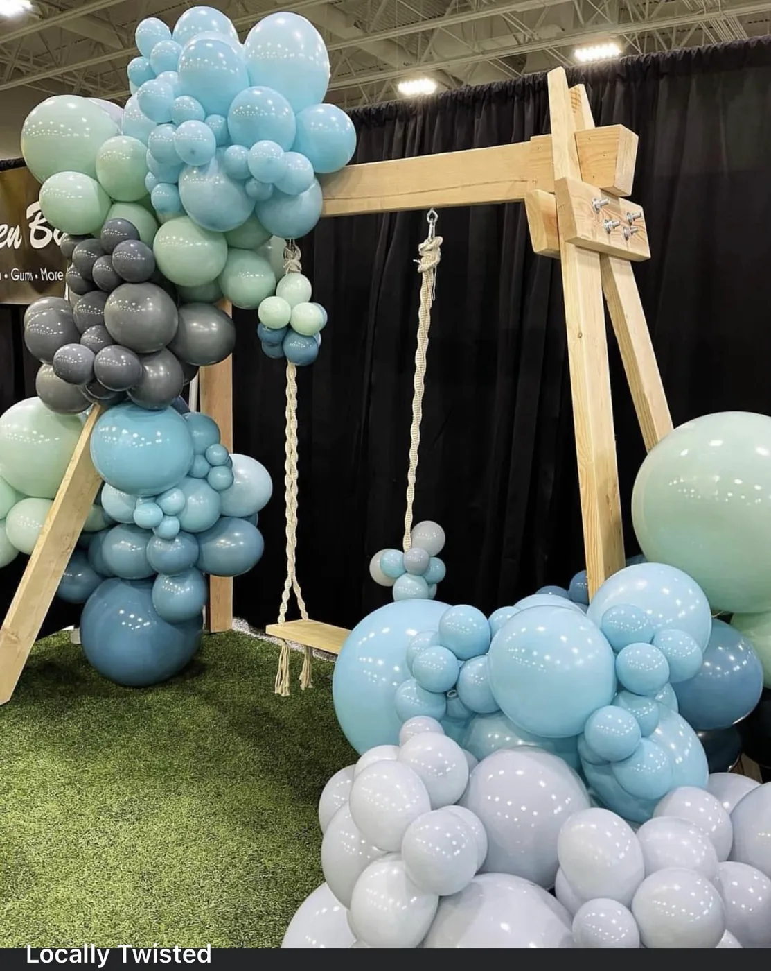 Organic balloon garland on a swing frame